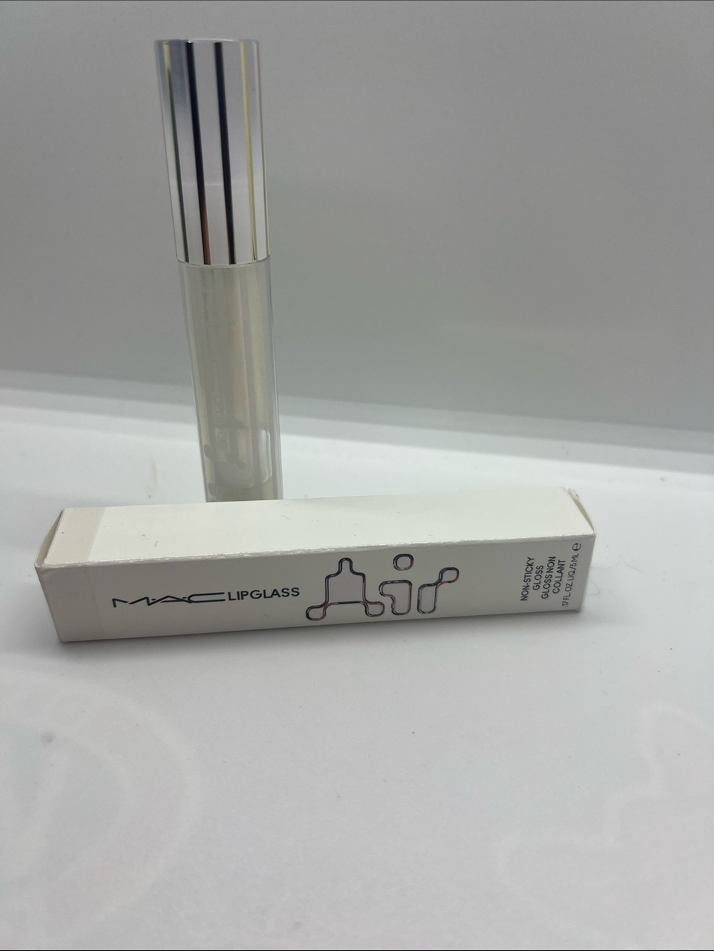 MAC Cosmetics Lipglass Gloss in frosting clear Tube with Silver Cap